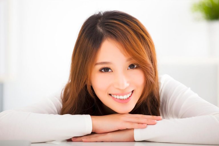 Asian woman smiling at the camera